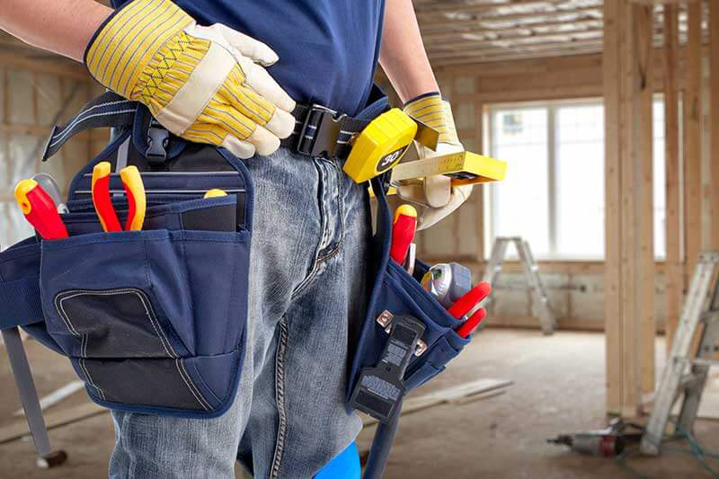 a man wearing a tool belt